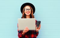 A happy woman on her laptop