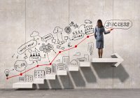 Woman on staircase leading up to success