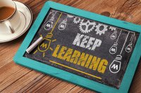 Keep learning written on a chalkboard