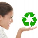 Young woman holding recycling image in her hand