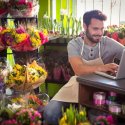 Professional Florist surrounded by blooms