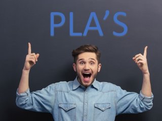 Young Man pointing up to the phrase "PLA's"