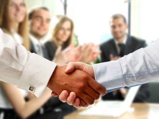 Business associates shaking hands