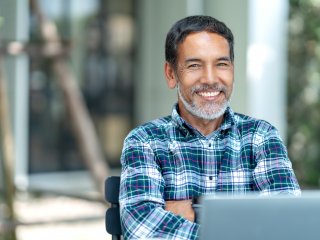 Professional man sitting in front of laptop