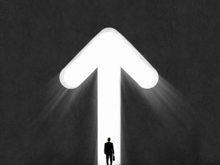 Businessman standing under upward Arrow